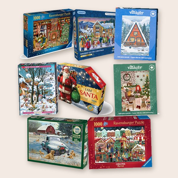 Holiday jigsaw puzzle boxes from Ravensburger, Cobble Hill, Gibsons, Villager and Heye, plus the I Am Santa puzzle
